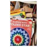 Craft Supplies and Holiday Decorations including Yarn, Wrapping Paper, and Quilting Magazines with rolling drawer plastic cabinet