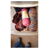 Craft Supplies and Holiday Decorations including Yarn, Wrapping Paper, and Quilting Magazines with rolling drawer plastic cabinet