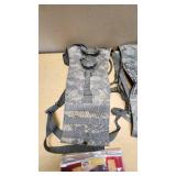 Military Tactical Gear and Ammunition Lot including Remington Premier Magnum 10 Gauge Ammo, Tactical Vest, Hydration Pack, and Accessories