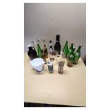 Collection of Vintage Beverage Bottles and Cans Including Miller, Schlitz, 7-Up, and Coca-Cola