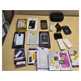 Various Phone Accessories Including OtterBox Defender Case, Mophie Juice Pack, and Samsung S-View Flip Covers