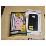 Various Phone Accessories Including OtterBox Defender Case, Mophie Juice Pack, and Samsung S-View Flip Covers