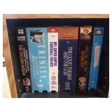 Collection of DVDs and VHS Tapes with Tower Cabinet