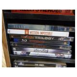 Collection of DVDs and VHS Tapes with Tower Cabinet