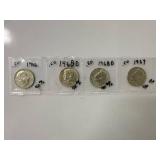 Four Kennedy Half-Dollar Coins