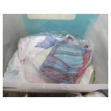 Clear Plastic Storage Tote with Assorted Linens, Towels & Decorative Home Decor