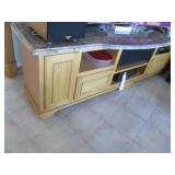 Wide solid wood entertainment stand with a granite top