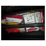 Tool box filled with hand tools and...