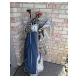 Golf clubs and balls in a golf bag...