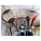Golf clubs and balls in a golf bag...