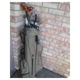 Golf clubs and balls in a golf bag...