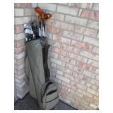 Golf clubs and balls in a golf bag...