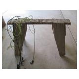 Wooden saw horse with bungee net...