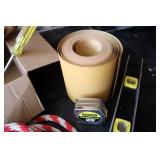 Mixed tools, sandpaper roll, tape m...