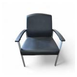Lorell healthcare reception guest chair featuring black antimicrobial vinyl upholstery and a silver powder-coated steel frame.