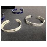 Necklace - Silver Tone Chain with Lot of Cuff Bracelets w Ruler Designs & One w Blue Crystal