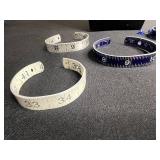 Necklace - Silver Tone Chain with Lot of Cuff Bracelets w Ruler Designs & One w Blue Crystal