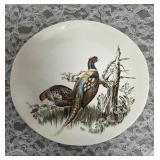 Vintage plate (1953-1976) from the "Game Birds" series featuring a pheasant design.  Features hand-engraved style illustrations of game birds. Manufactured by the Johnson Brothers, crafted in England.