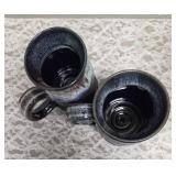 Two handmade stoneware mugs commonly sold as souvenirs at Renaissance Festivals.  Produced by Deneen Pottery.