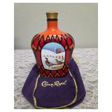 Three upcycled Crown Royal whiskey decanters that appear to be hand painted and decoupaged. The bottles come with Crown Royal velvet bags.The artist signature is Bickford that appears on the decanter.