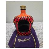 Three upcycled Crown Royal whiskey decanters that appear to be hand painted and decoupaged. The bottles come with Crown Royal velvet bags.The artist signature is Bickford that appears on the decanter.