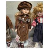 Three collectible porcelain dolls.  From the Premier Doll collection.