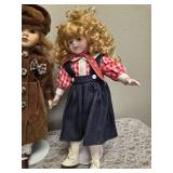 Three collectible porcelain dolls.  From the Premier Doll collection.