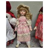 Three collectible porcelain dolls.  From the Premier Doll collection.