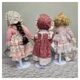 Three collectible porcelain dolls.  From the Premier Doll collection.