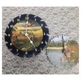 Two sawblade painted clocks.  The clock edged in black works (has new batteries) the other does not.