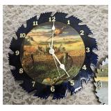 Two sawblade painted clocks.  The clock edged in black works (has new batteries) the other does not.