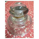 Vintage Clear glass power insulator, commonly called a "Ink Well", "Frog Eye" or "Saddle Style" and  used on telephone or telegraph poles to hold wires while preventing electricity from grounding.