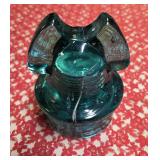 Mickey Mouse glass insulator specifically a CD 257 type manufactured by Hemingray. Were used on power poles to insulate telegraph and telephone wires from the wooden poles holding them.