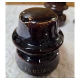 Five Vintage Brown porcelain/ceramic insulators used for telegraph or telephone lines.