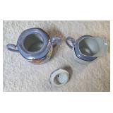 Vintage Art Deco Japanese Lusterware creamer and sugar bowl set.  Features a hand-painted iridescent glaze with a stylized abstract floral or geometric pattern.  Produced in Japan likely between 1921-