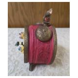 Vintage, hand painted resin musical clock with spinning hands featuring animated twirling mice, often sold as a decorative collectible or music box.  Check out you-tube video in photos.