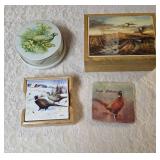 One- Riley Brothers Toffee Tine, Four-Pheasant Coasters in holder, One-Pheasant Coaster that says South Dakota on it, One- Velvet lined box. The picture on the front of the box appears the deco has li