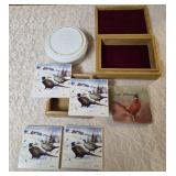 One- Riley Brothers Toffee Tine, Four-Pheasant Coasters in holder, One-Pheasant Coaster that says South Dakota on it, One- Velvet lined box. The picture on the front of the box appears the deco has li
