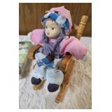 One - Horse windchime/mobile, One-bag of Cocktail napkins, One-bisque porcelain doll featuring a matte, realistic finish on its head, hands, and feet, and soft cloth body seated in a wooden rocking ch