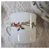 Four piece setting of Home Essentials Woodland Celebration dinnerware set.  Featuring snowman and holly branch patterns.