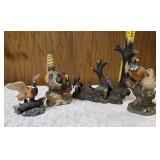 Three -Vintage Resin Figurines and 1 Pheasant on  Wagon Wheel Plate Holder.