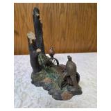 Three -Vintage Resin Figurines and 1 Pheasant on  Wagon Wheel Plate Holder.