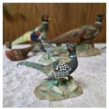Three vintage collectible pheasant figurines made of ceramic or porcelain and three small pheasant figurines. Features hand painted details with a glossy finish.