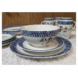 Vintage dinnerware set with 4 place settings is made by Thomson Pottery .  This set  is "Snowman Winterland Blue Sponge". Each place setting includes a dinner plate, salad plate, bowl and a mug.