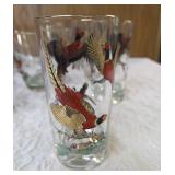 Hazel-Atlas Ice bucket and  8 glasses.   The glasses and Ice Bucket feature a 22K gold aim and detailed red, black and gold pheasant designs.