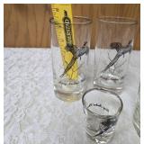 Five vintage barware glasses from the Federal Glass "Sportsman" Game Bird series, which typically features wildlife graphics and silver or gold rims.