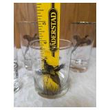 Five vintage barware glasses from the Federal Glass "Sportsman" Game Bird series, which typically features wildlife graphics and silver or gold rims.