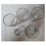 Five vintage barware glasses from the Federal Glass "Sportsman" Game Bird series, which typically features wildlife graphics and silver or gold rims.