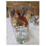 Eight vintage set of Hazel Atlas glassware in the Pheasant pattern, commonly found as part of Mid-Century Modern (MCM) barware sets and 3 shot glasses. Features flying pheasants in red, black and gold