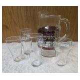 Four Vintage Coco-Cola glasses and Coca-Cola Tiffany-style stained glass Pitcher.